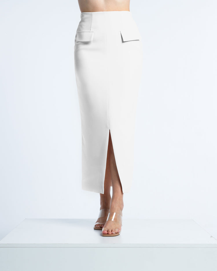 White high-waisted pencil skirt with front slit, pocket flaps, and clear heels on model