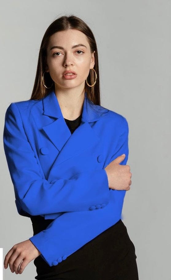 Woman wearing royal blue double-breasted blazer with gold hoop earrings
